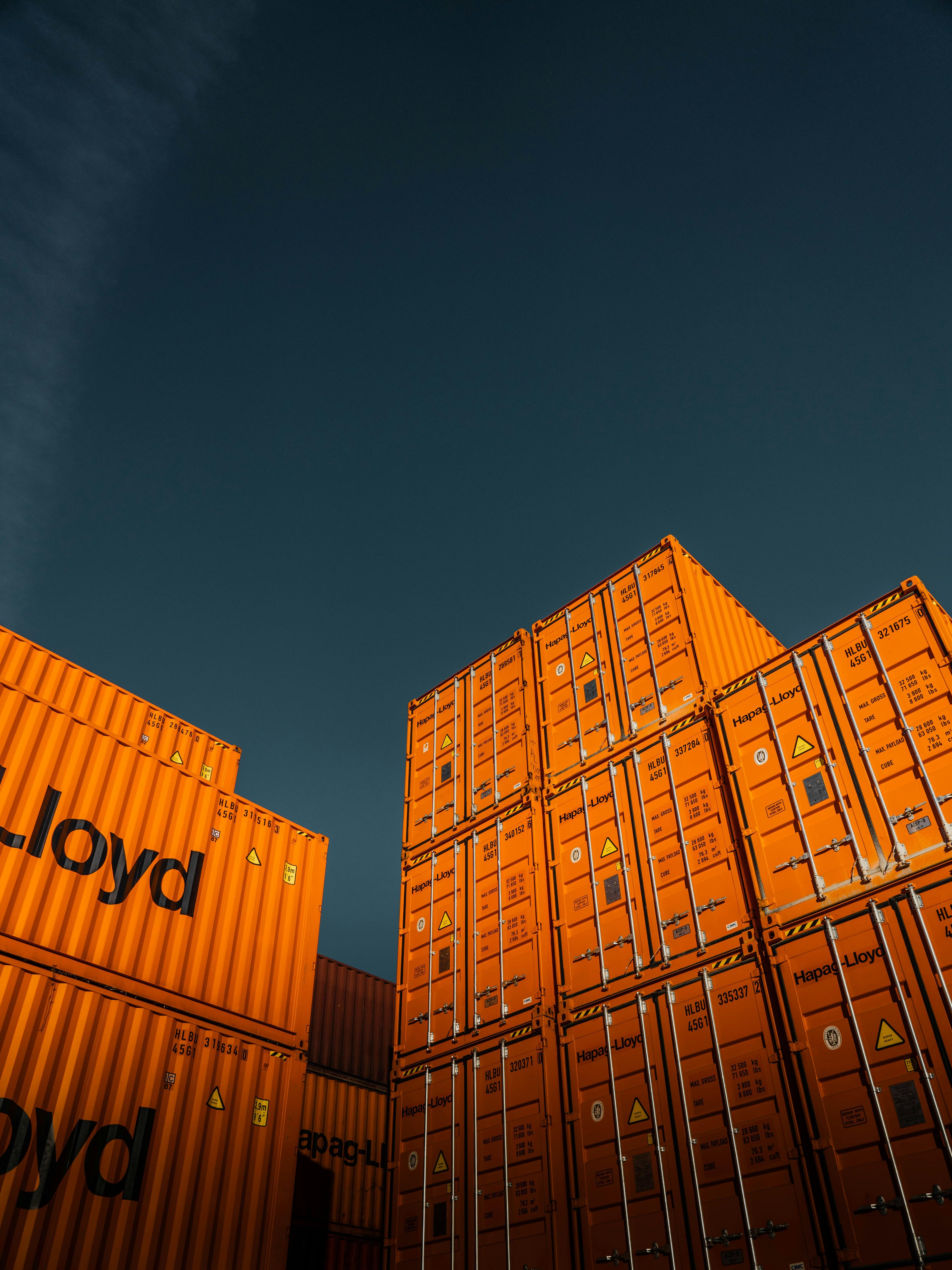 Stacked shipping containers prepared for international freight movement.